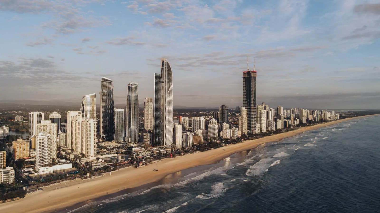 The Gold Coast skyline stretching along a sandy beach.